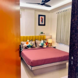 Modern bedroom with double bed and cozy interior in a fully furnished service apartment