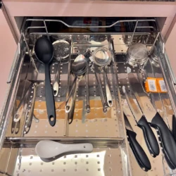 kitchen trolley having set of spoon and knives in service apartment for corporates