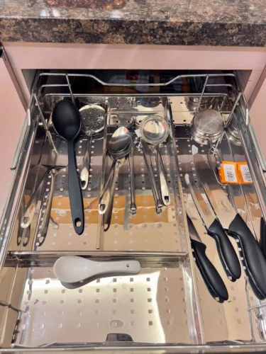 kitchen trolley having set of spoon and knives in service apartment for corporates
